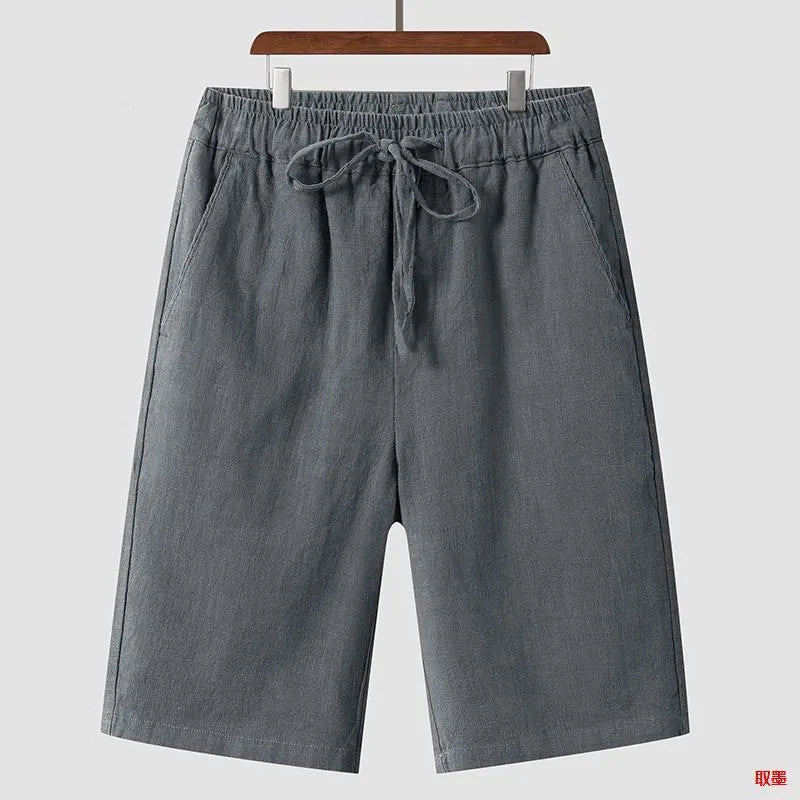 Men's linen shorts in loose cropped design with elastic waistband, shown in available colours
