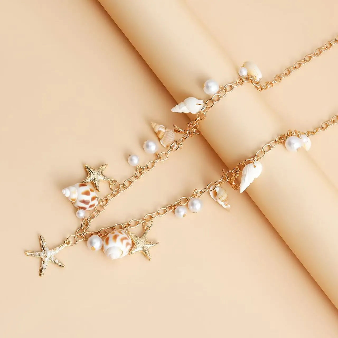 Women's beach shell star design waist chain and matching bracelet set in alloy material