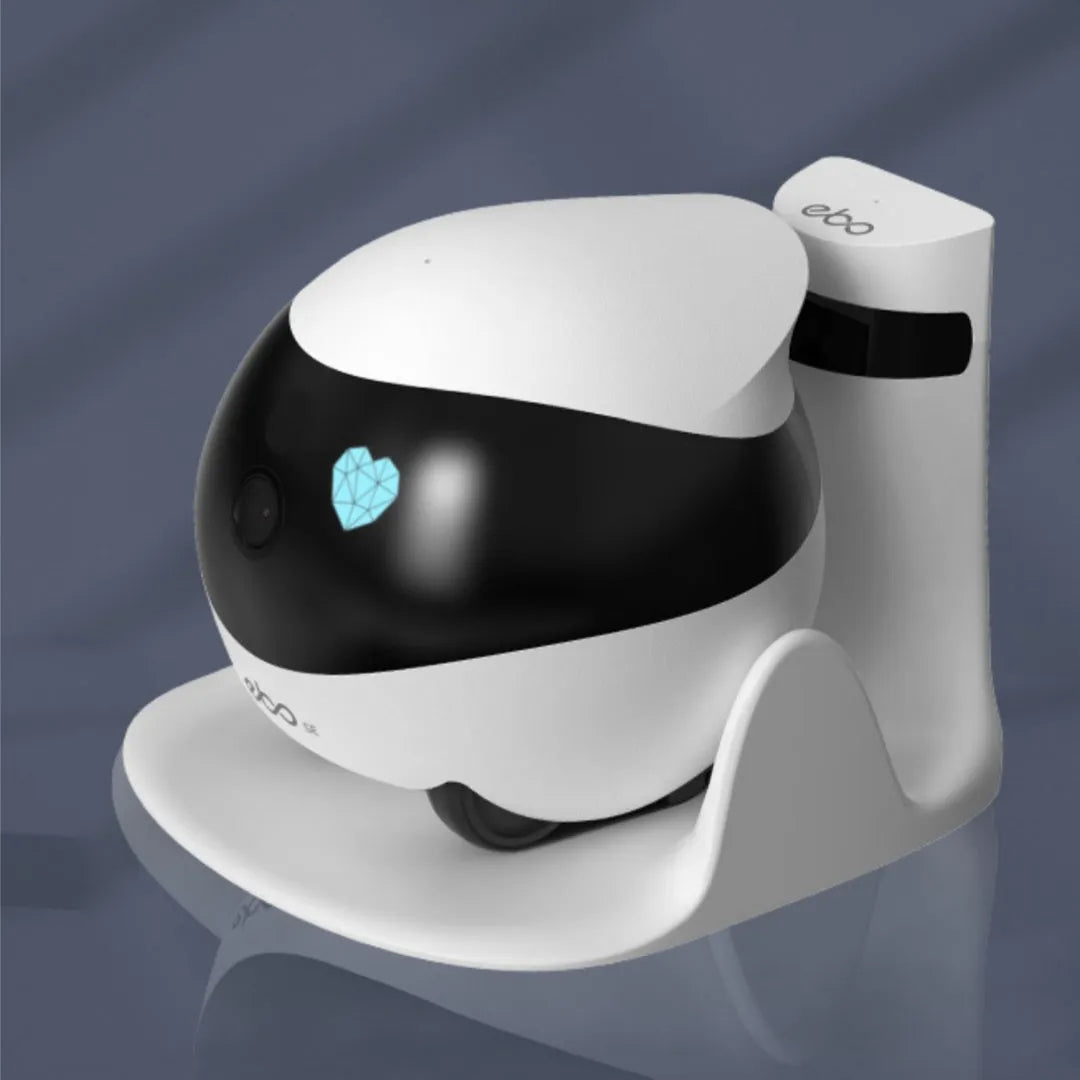 White mobile surveillance robot camera with automatic docking station on wooden floor