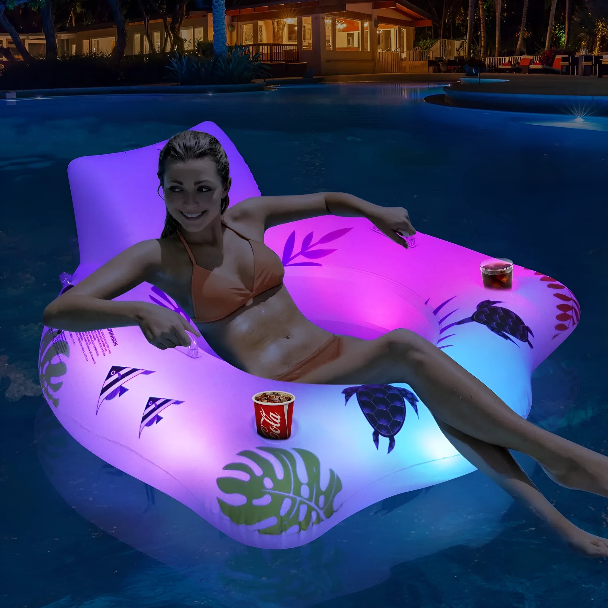 White U-shaped inflatable pool float with LED lights illuminated on water