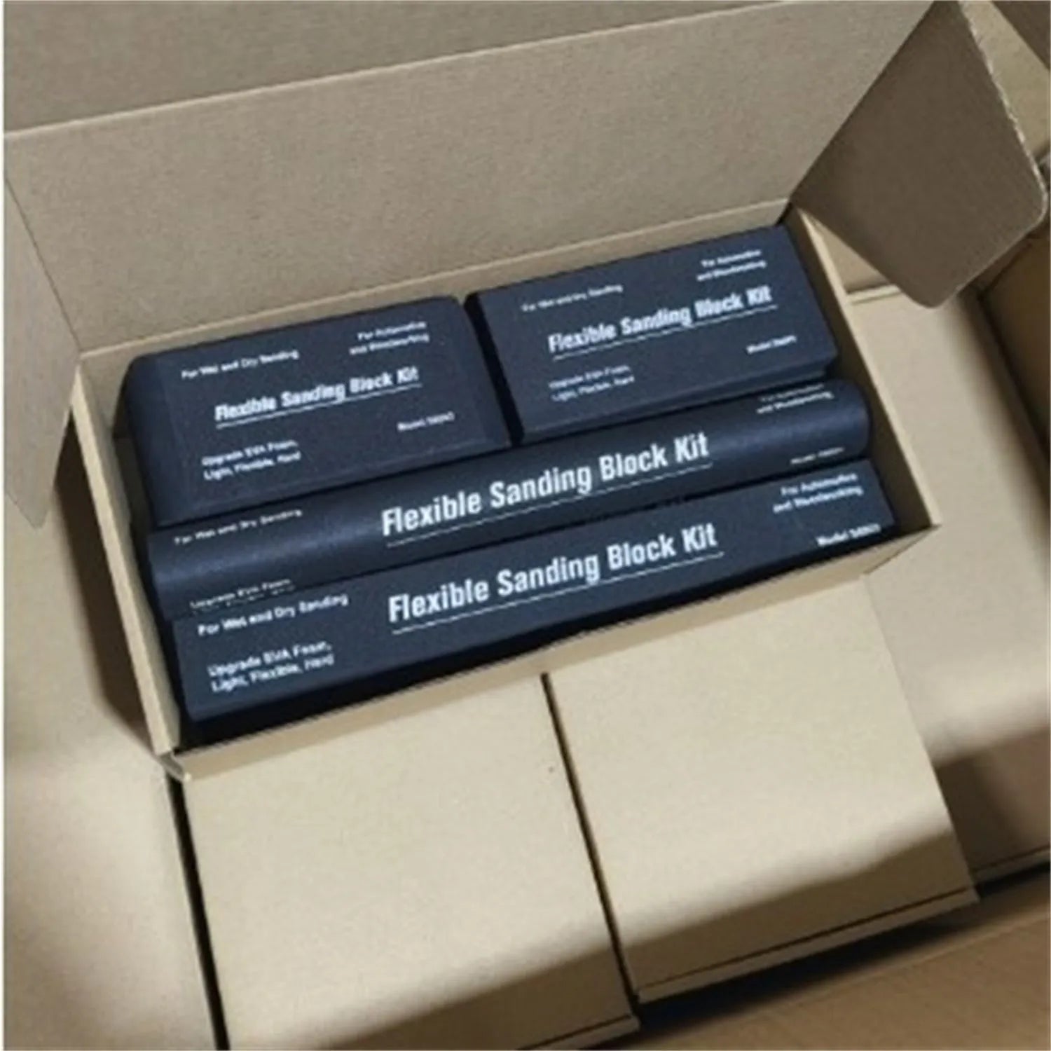 Set of seven black EVA frosted metal blocks arranged for workshop support and material positioning