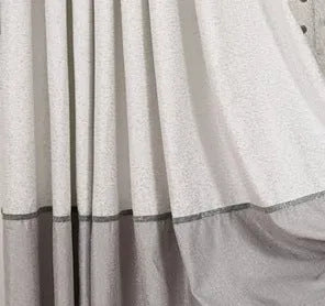 Single plain blackout curtain panel with hook tape heading, shown against a window.