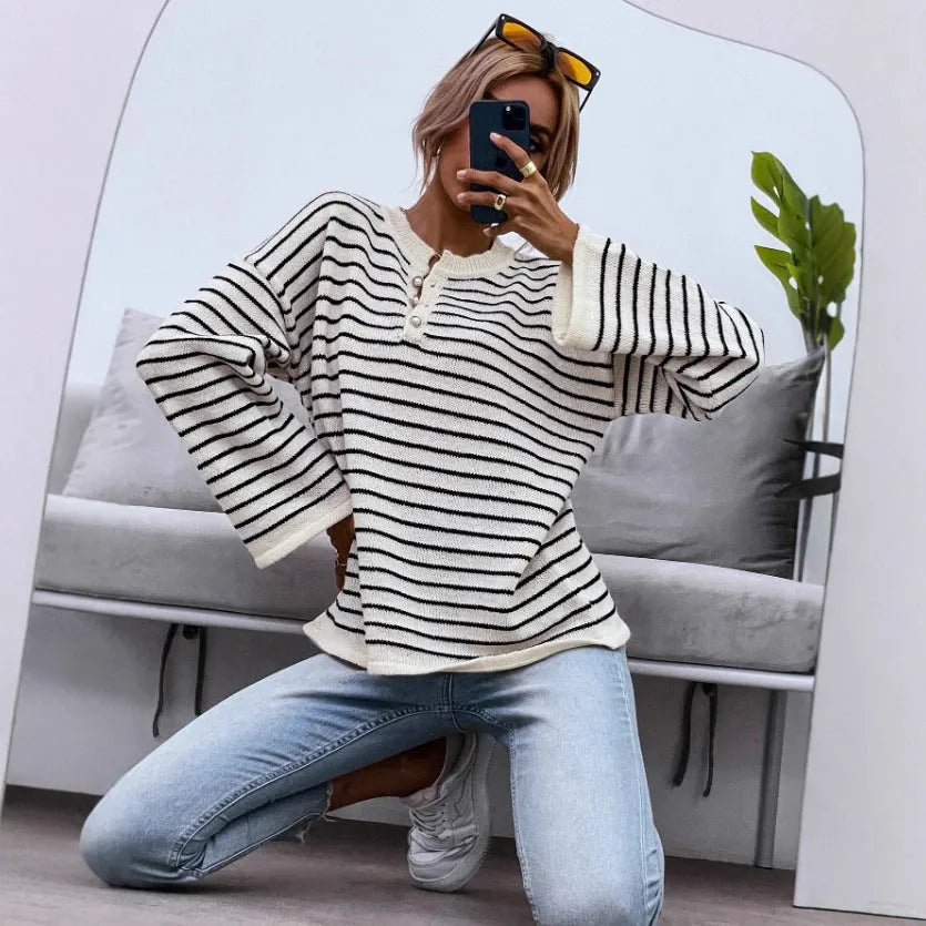 Black striped women's knitted top with drop shoulder sleeves and button detailing