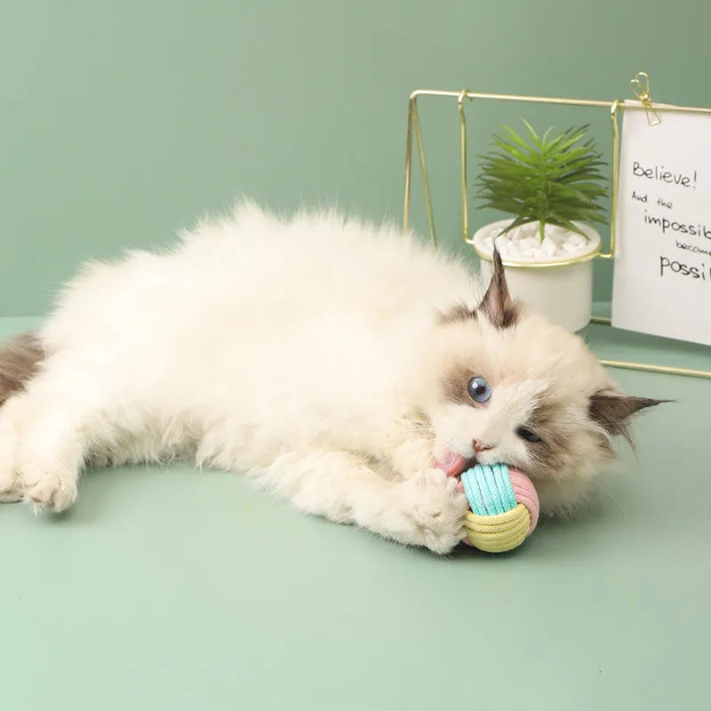 Handmade 5cm plush cotton ball cat toy in multiple colours for teeth grinding and interactive play