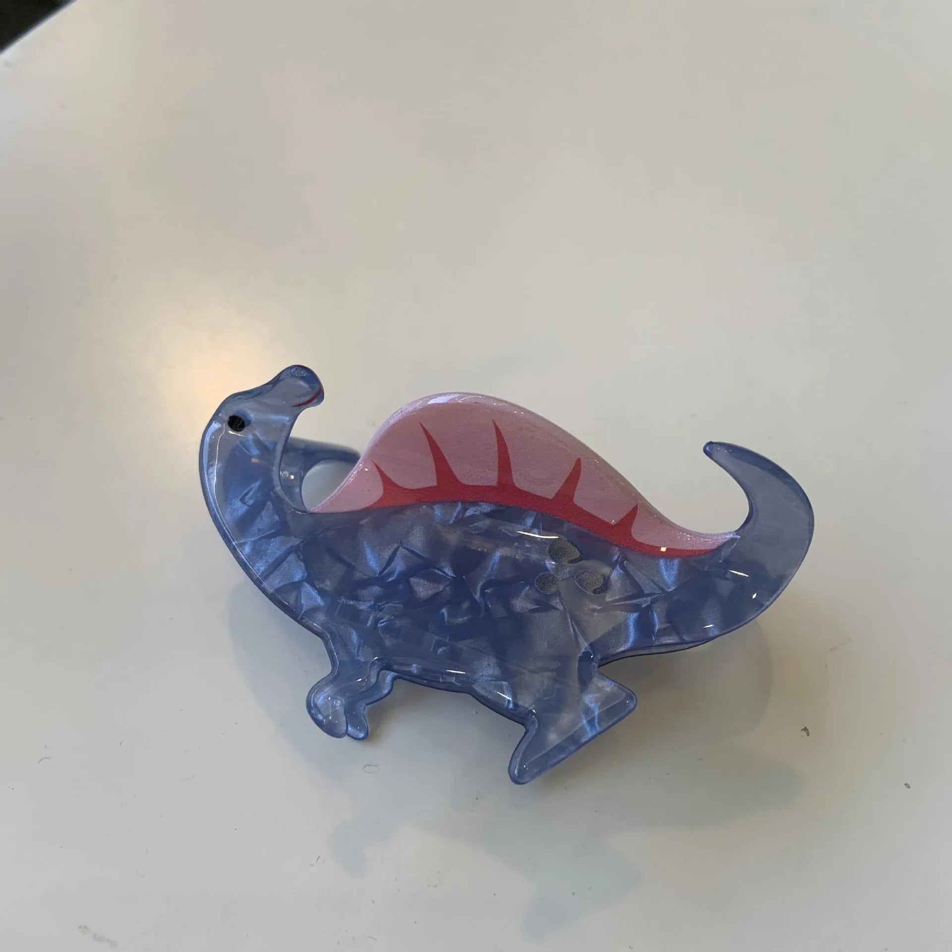 Colourful dinosaur acrylic jaw hair grip clip showing six design variations