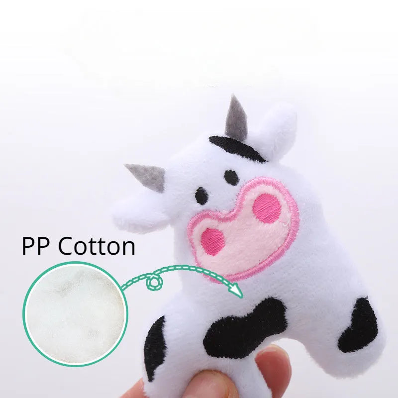 Soft plush cat toy shaped like a cow or parrot, filled with catnip, on a neutral background.