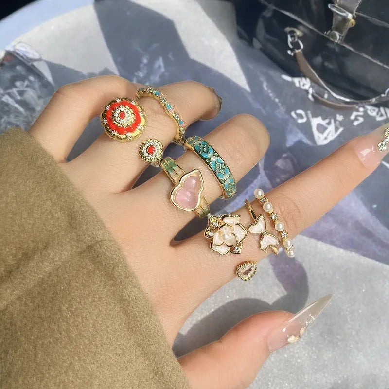 Adjustable copper gourd ring with flower and bow design in New Chinese style featuring inlaid zircon stones