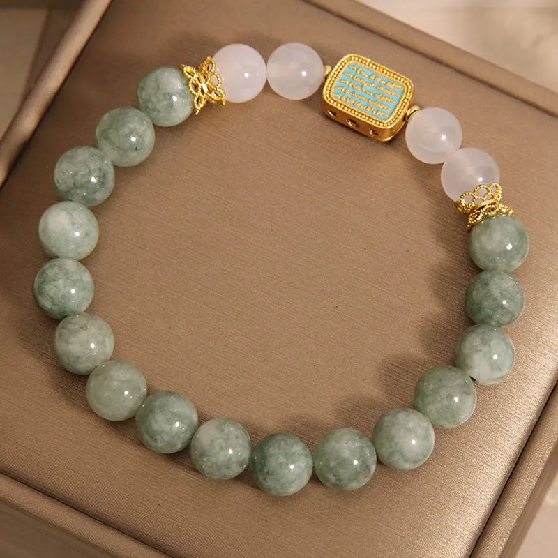 Oil green emerald crystal bracelet for women with five scripture charms on a white background.