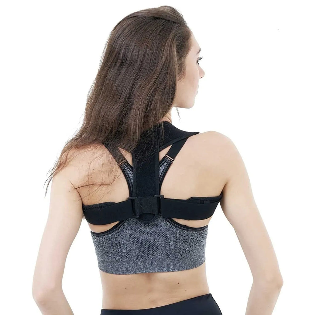Black adjustable posture correction strap showing breathable fabric and adjustment mechanism