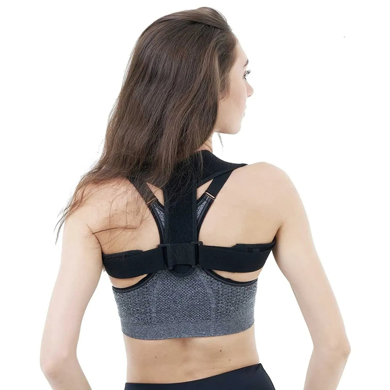 Black adjustable posture correction strap showing breathable fabric and adjustment mechanism