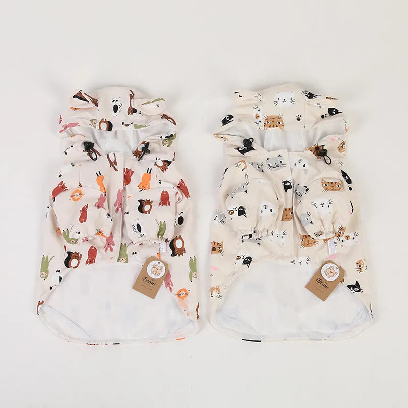 Beige dog raincoat with cartoon animal design in waterproof PU material