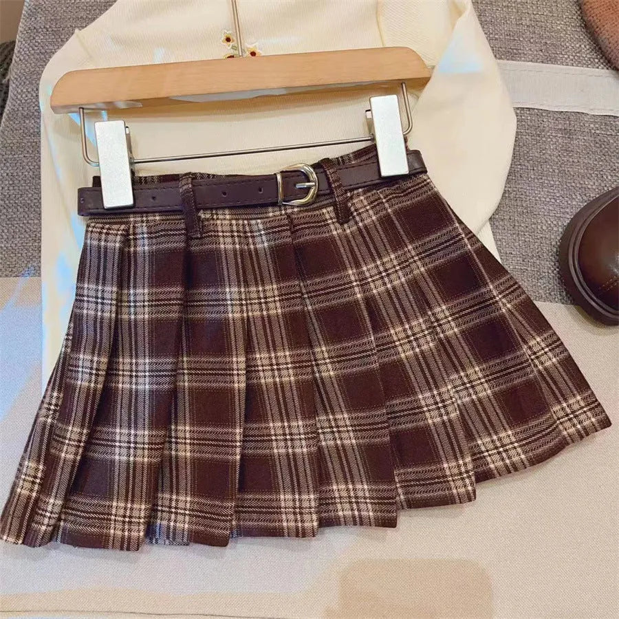 Girls' plaid pleated A-line skirt made from cotton blend fabric with a full lining.