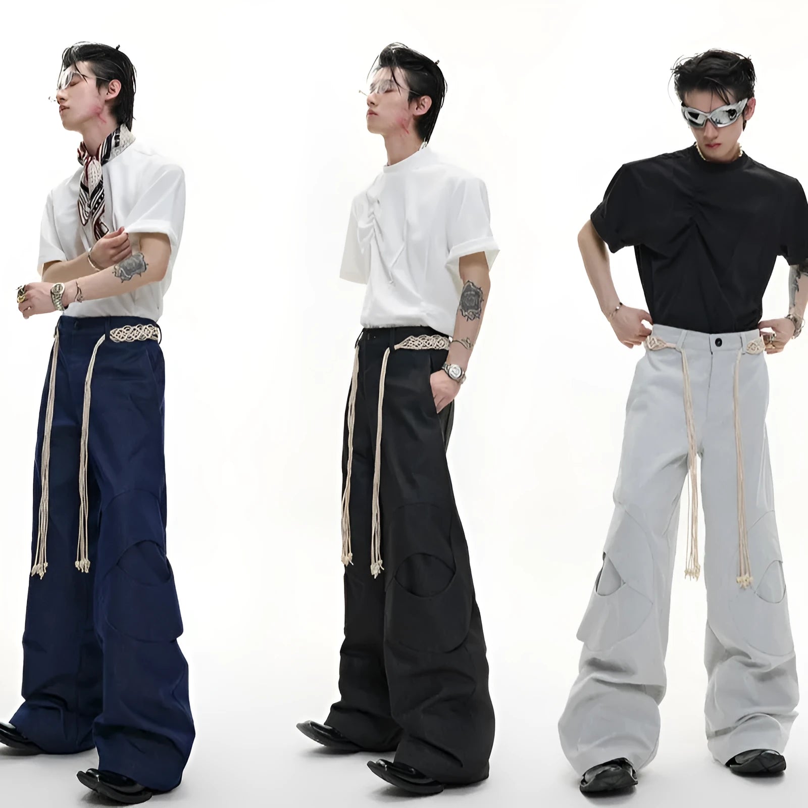 Men's dark blue straight-leg cotton jeans with heavy stitching on belt and zip decorations, shown in a loose fit.