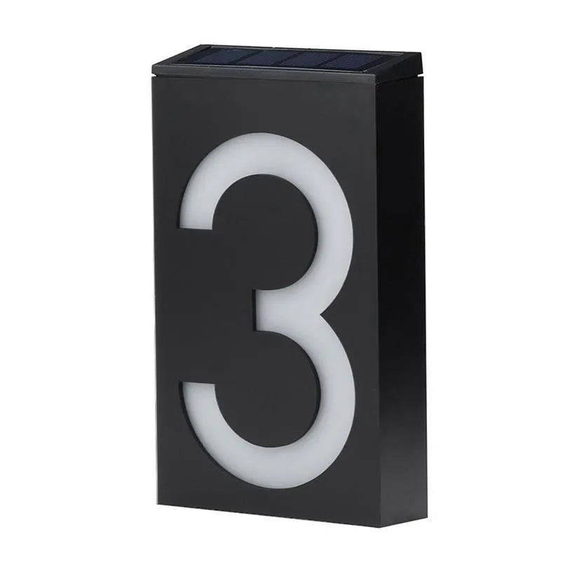 Solar powered house number light with 6 LEDs and IP65 waterproof rating mounted on an exterior wall.
