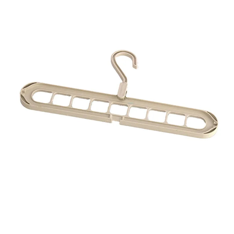 A green plastic multifunctional hanger with nine holes for trousers, shown in a folded and unfolded position.