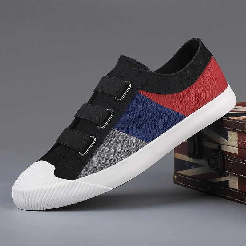 Men's beige canvas low-top sneakers with elastic band fastening and a vulcanised rubber sole.