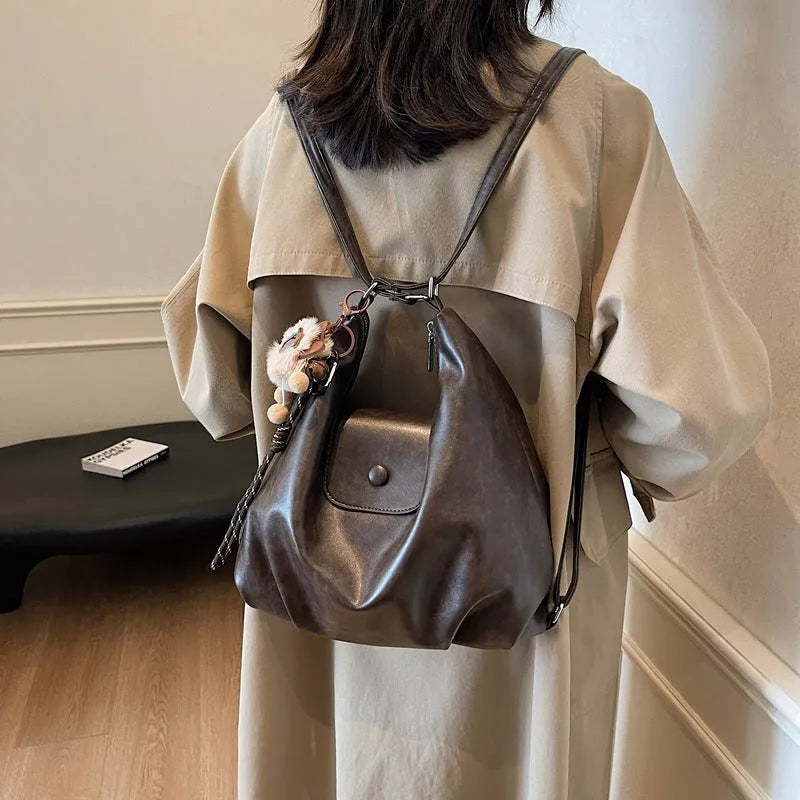 Women's black PU leather single shoulder bag with horizontal square shape and dedicated phone compartment