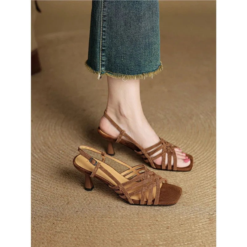 Retro style women's sandals with thin cross straps, ankle buckle, square toe, and a mid-height heel.