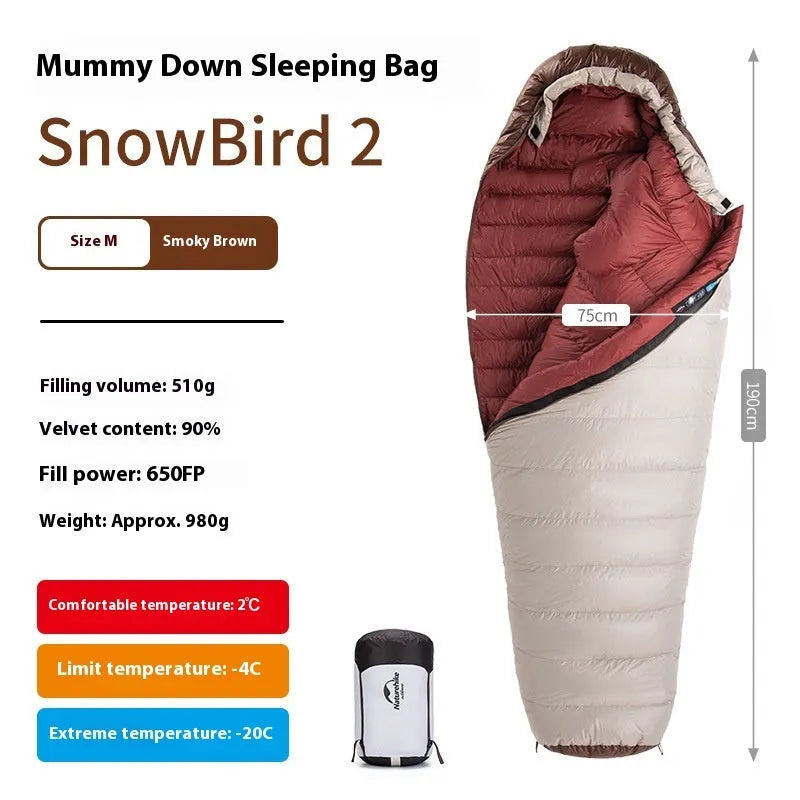 Adult mummy-style sleeping bag with goose down insulation shown with its storage bag.
