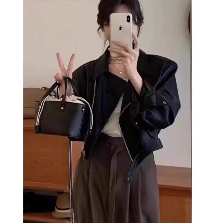 Women's retro slim fit imitation leather jacket in black with pocket detail, 40cm length