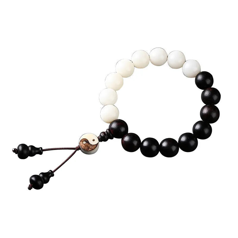 White and blackwood bead bracelet in eight-diagram pattern with natural bodhi seeds