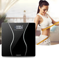 Black electronic bathroom scale with digital display showing weight measurement