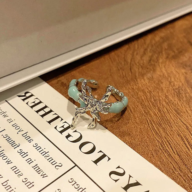 Creative Chinese butterfly women's copper ring with dripping oil treatment process in simple style.