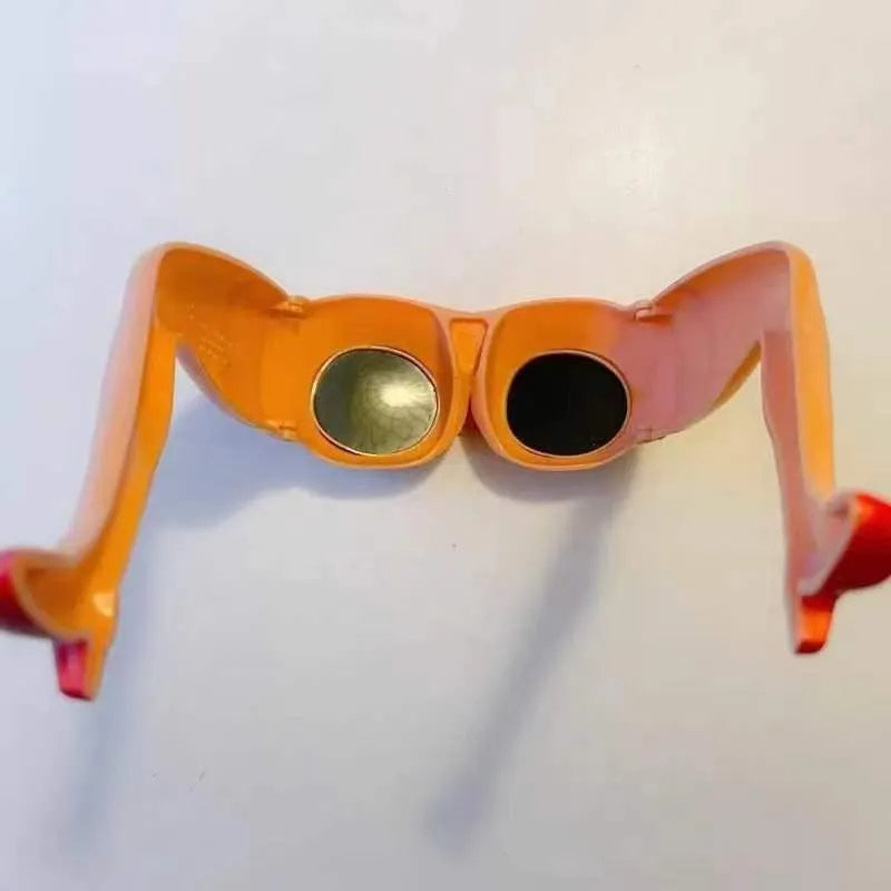 Orange plastic Personality Leg Hip Sunglasses showing novelty leg and hip motif design.