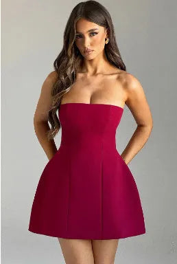 Women's solid colour backless tube dress with high waist and A-line short skirt.