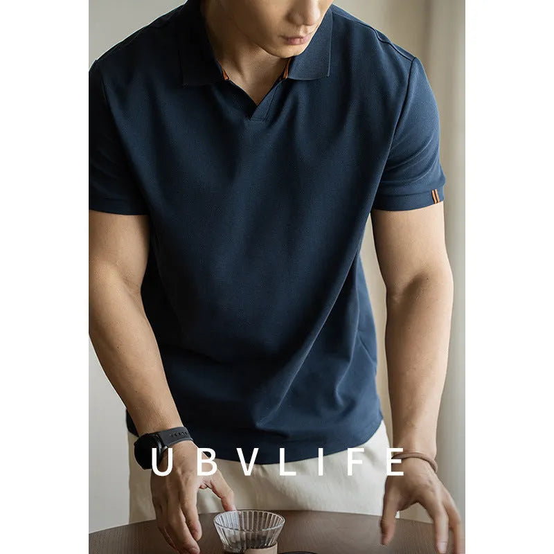 Man's blue American-style short-sleeved cotton blend polo shirt on a hanger.