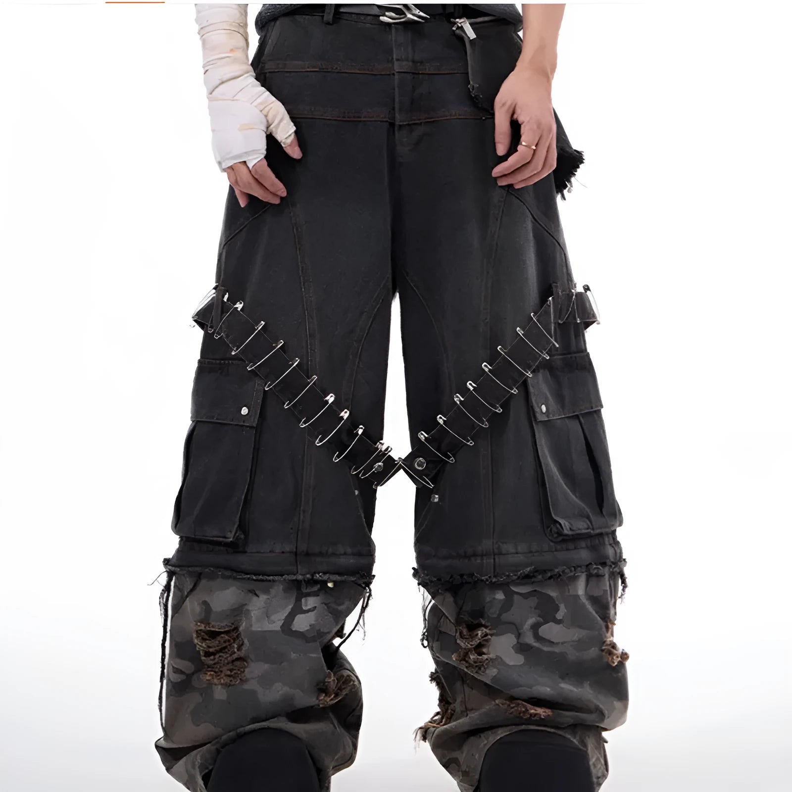 Men's grey camouflage print jeans with splicing panel construction and ribbon detail.