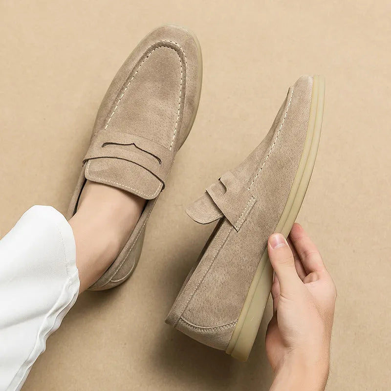 Men's beige leather slip-on casual shoes with a round toe and rubber sole.