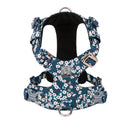Floral print cotton dog chest harness on a dog, showing adjustable straps and pull-resistant design.