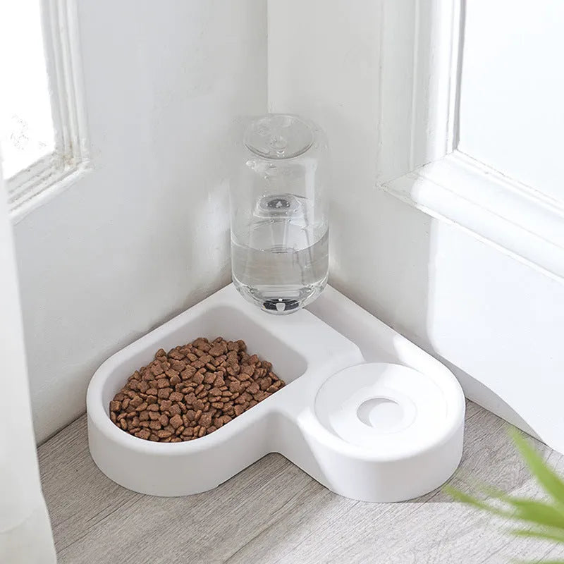 White indoor pet water fountain for cats and dogs on a kitchen floor