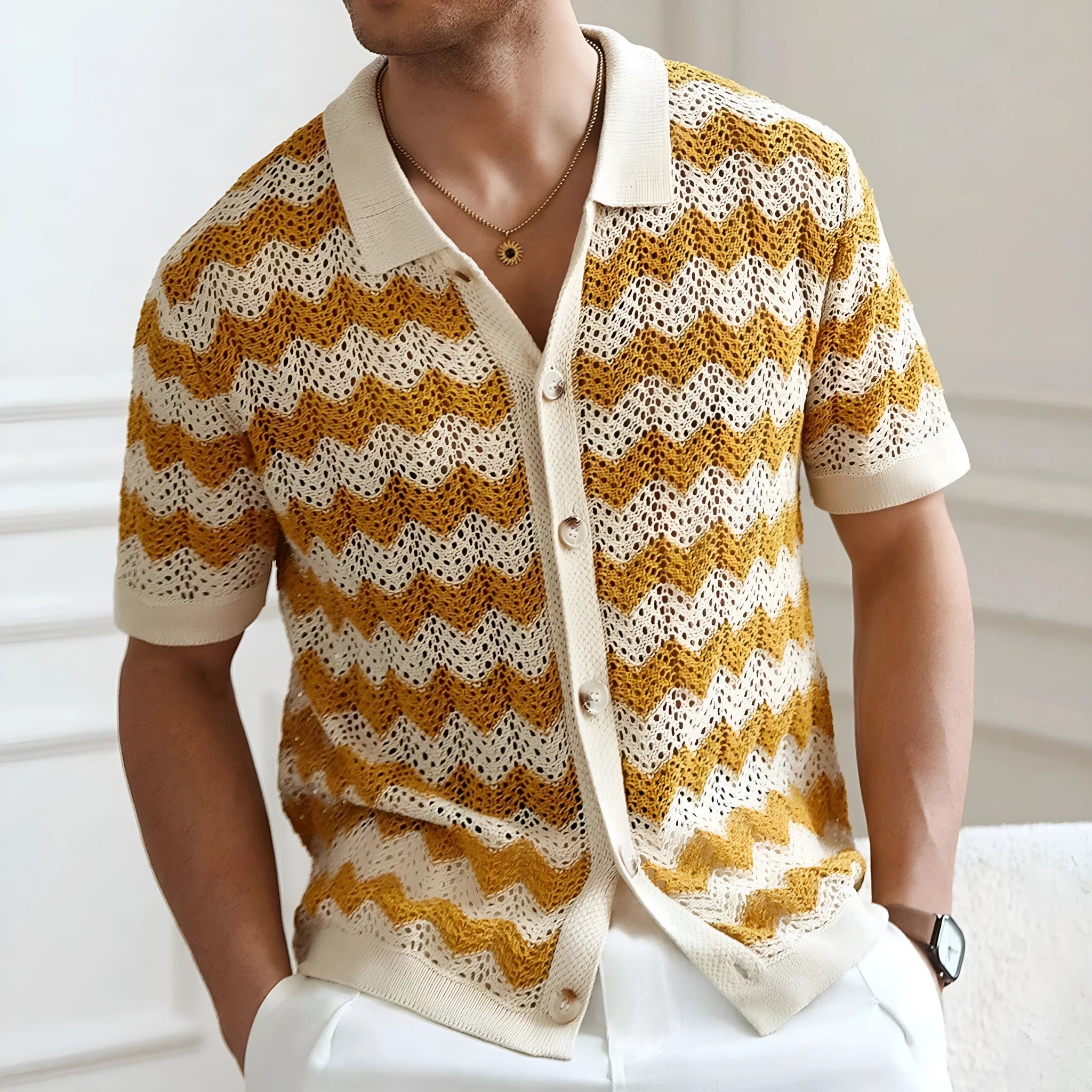 Short sleeve blue hollow jacquard corrugated sweater with flocking detail on a hanger.
