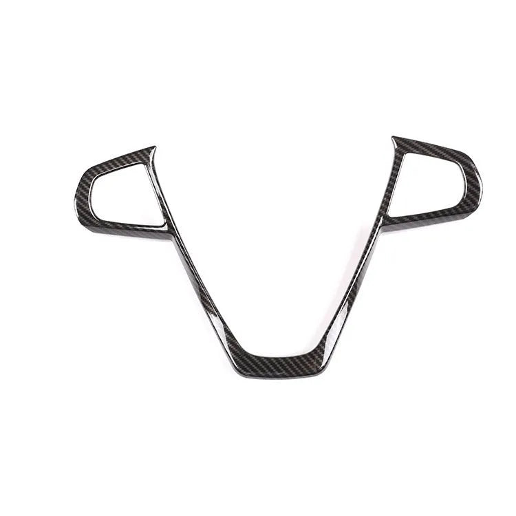 BMW steering wheel button frame decoration in black carbon fibre pattern.