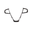 BMW steering wheel button frame decoration in black carbon fibre pattern.