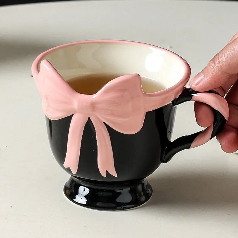 Ceramic heart bow mug with 301-400ml capacity in black pink or white powder colour