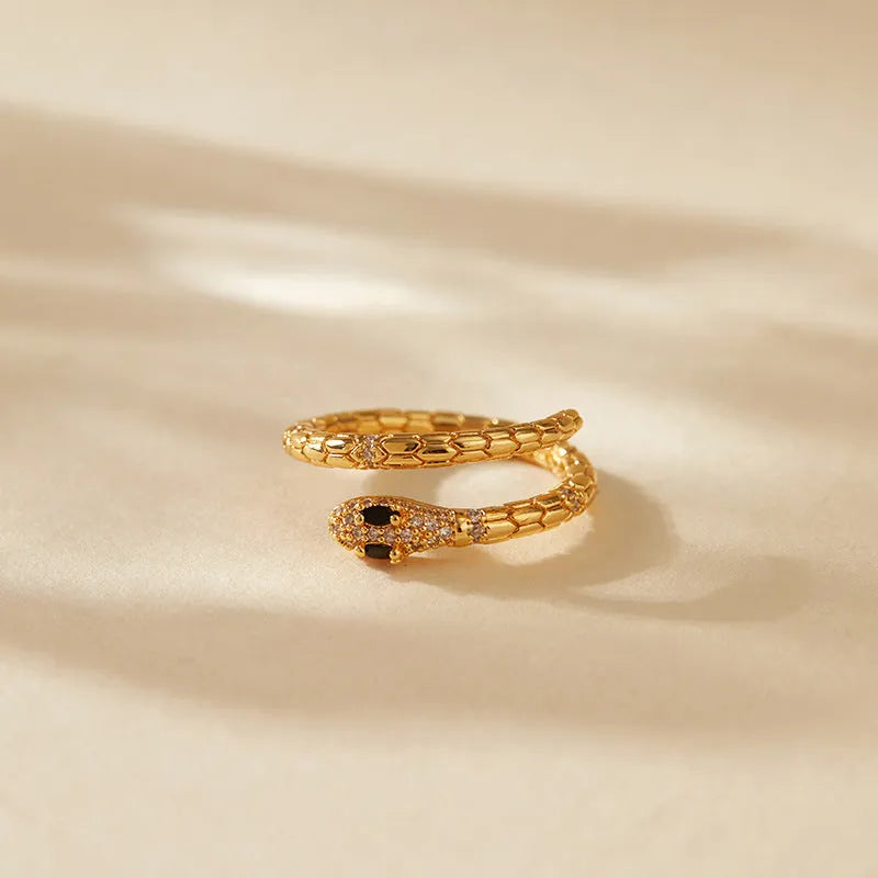 Snake-shaped adjustable copper ring with 18K gold colour finish and detailed animal modelling