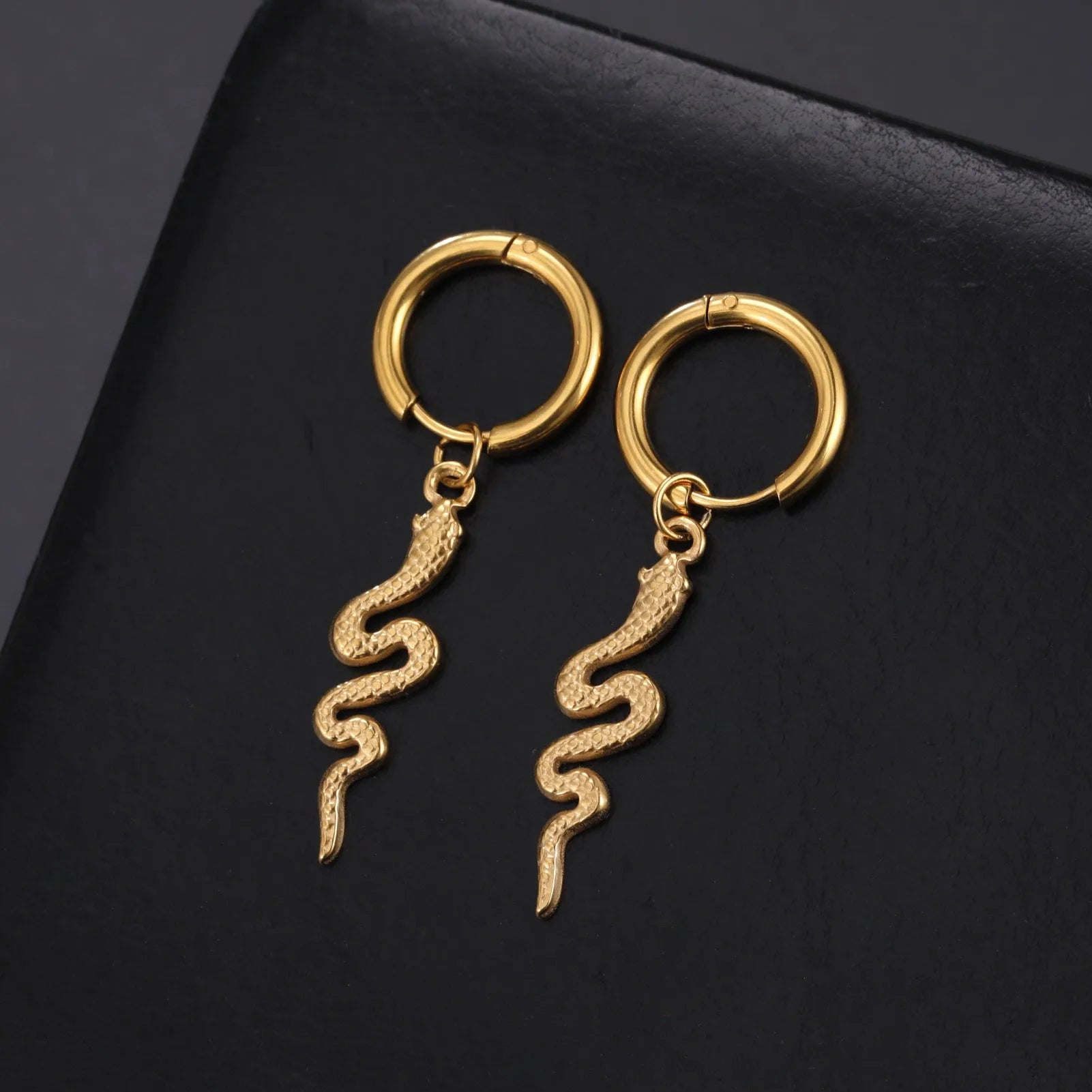 Gold plated stainless steel snake-shaped vintage clip-on earrings for women.