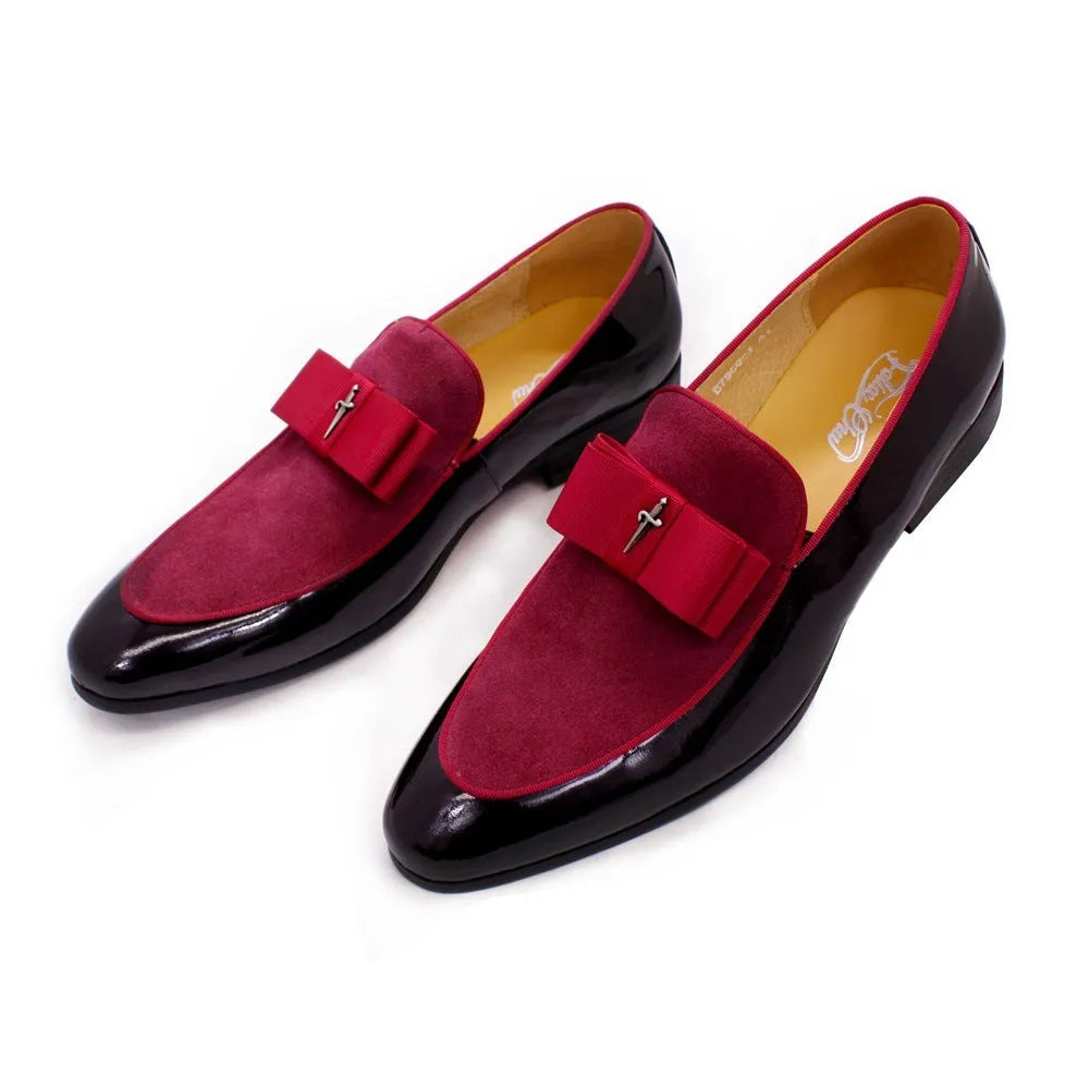 Men's black patent leather low-top shoes with a gold tassel detail and rubber sole.