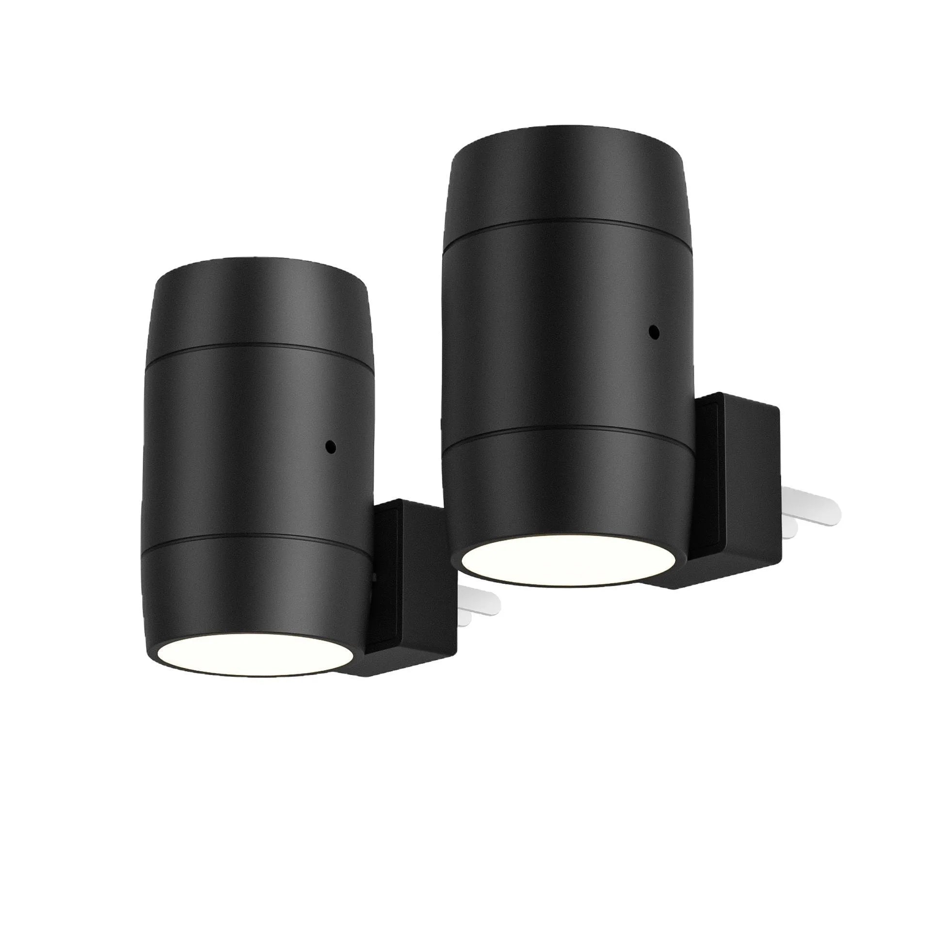 Small white adjustable plug-in night lamp with rotatable head shown in a bedside socket