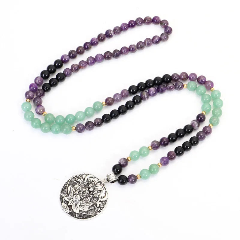 Dongling long yoga lotus pendant necklace and bracelet set with geometric alloy pendant and stone beads.