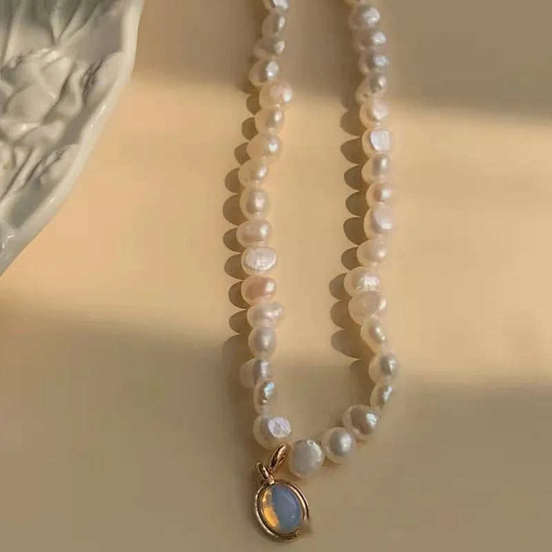 French court vintage style necklace with geometric alloy pendant and pearls on an adjustable chain.