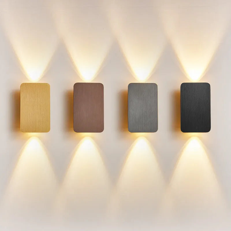 Minimalist modern LED wall lamp in black finish mounted on a wall