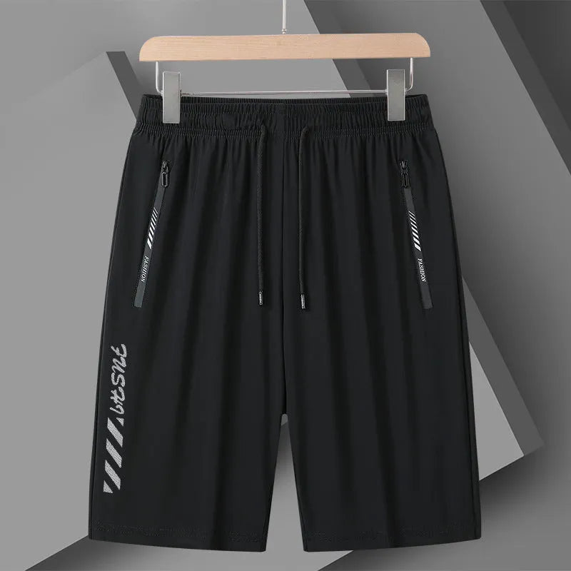 Man wearing black loose-fit quick-drying nylon sports shorts for summer.