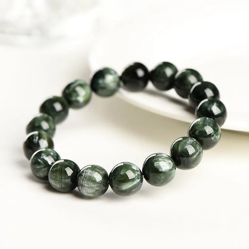 Green Dragon Crystal bracelet with 8-9mm round beads featuring geometric Ruyi design elements