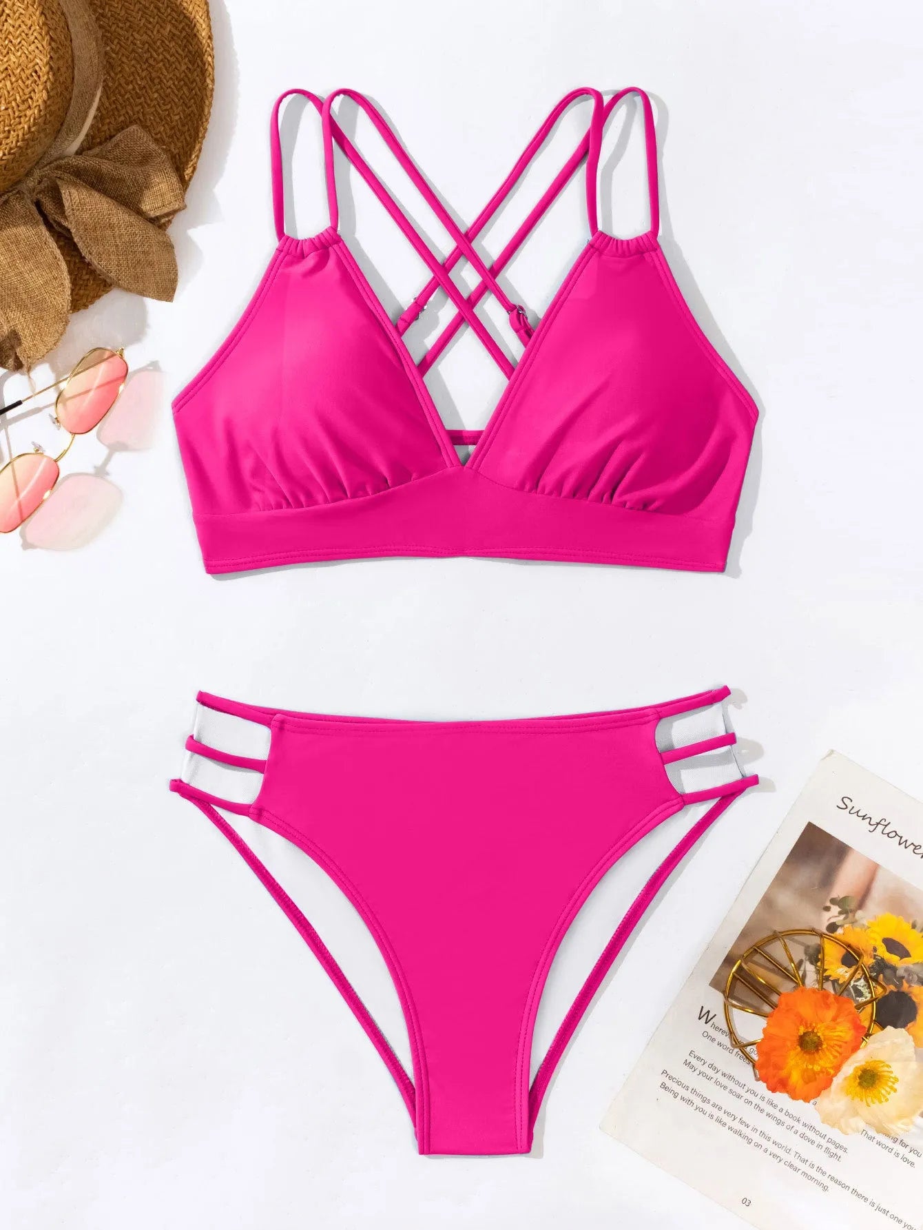Women's black V-neck halter bikini with split leg shorts on a mannequin.