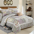Washed pure cotton quilted bedspread set with one large cover and two pillowcases on a bed.