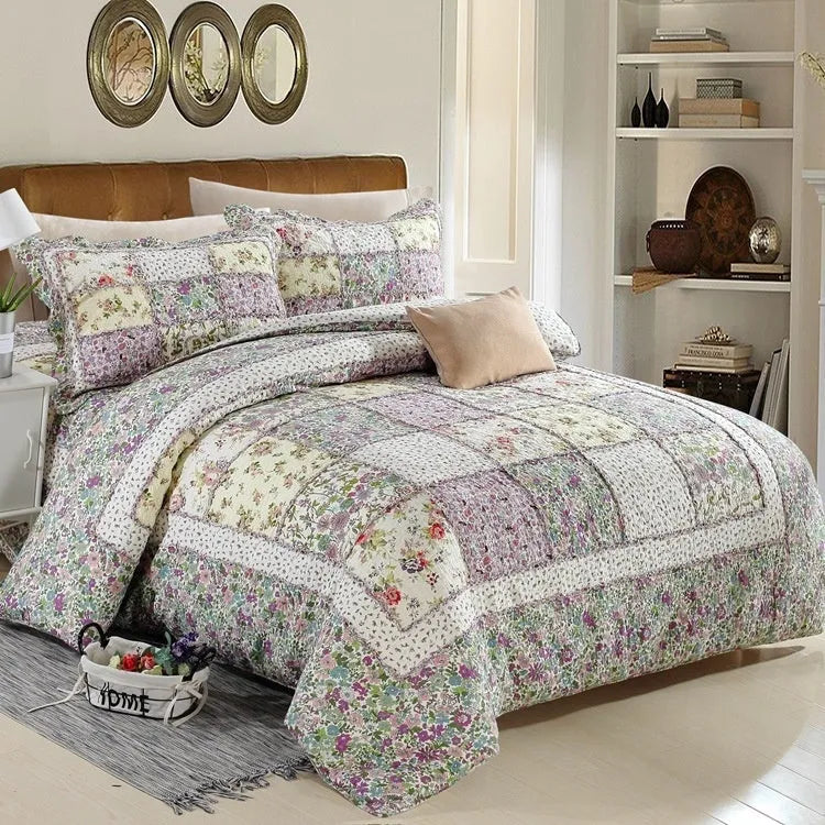 Washed pure cotton quilted bedspread set with one large cover and two pillowcases on a bed.